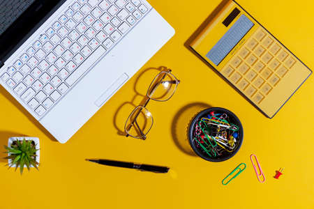 Items for business on bright colors in the office on the tableの写真素材