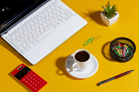 Items for business on bright colors in the office on the tableの写真素材