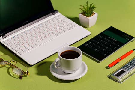 Items for business on bright colors in the office on the tableの写真素材