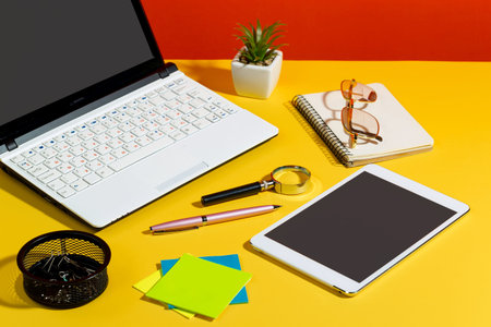 Items for business on bright colors in the office on the table