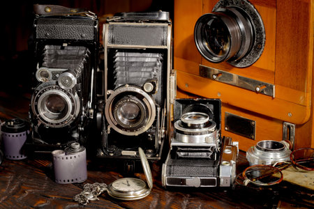 Vintage camera and lenses on a wooden background. Close-upの写真素材