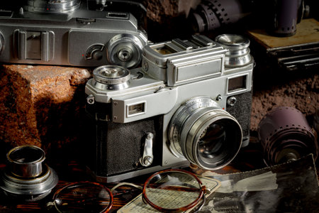 Vintage camera on the background of old photos, close-upの写真素材