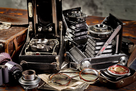 Old camera and other old items on a wooden table. Vintage style.の写真素材