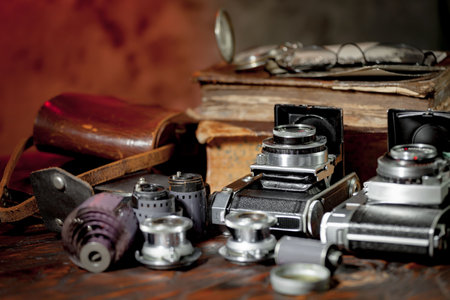 Vintage camera and other old things on wooden table. Selective focus.の写真素材