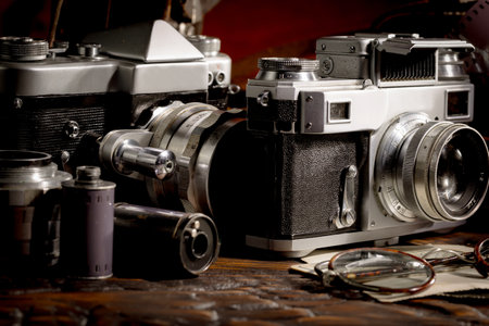 Retro camera on a wooden table. Vintage style photo camera.の写真素材