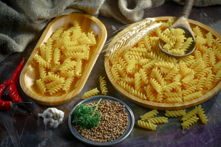 Variety of types and shapes of Italian pasta on the table.の写真素材