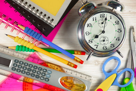 School supplies on a wooden background. Back to school. Copy space.