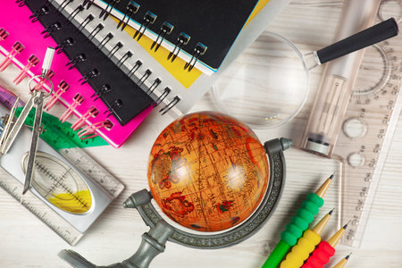 School supplies and globe on wooden table. Back to school concept.の写真素材