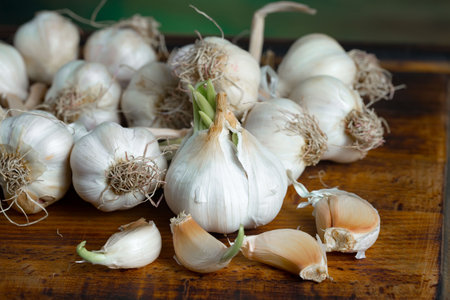 Garlic on the wooden table. Garlic is a healthy vegetable.の写真素材