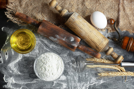 Baking background with flour, eggs, rolling pin and utensilsの写真素材