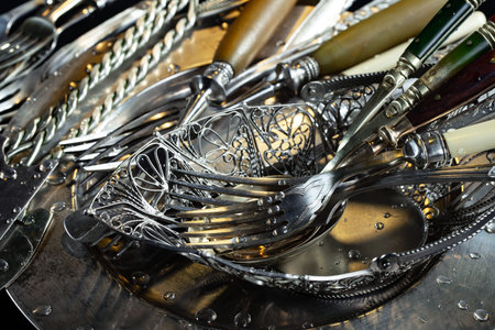 Vintage cutlery on a black background. Selective focus.