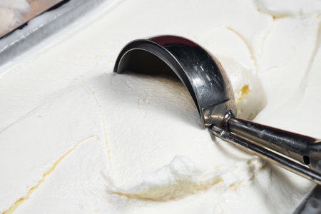 vanilla ice cream in a plastic container, closeup of photoの写真素材