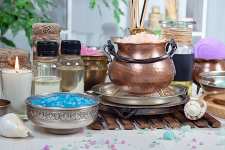 Spa still life with sea salt and aroma sticks on wooden tableの写真素材