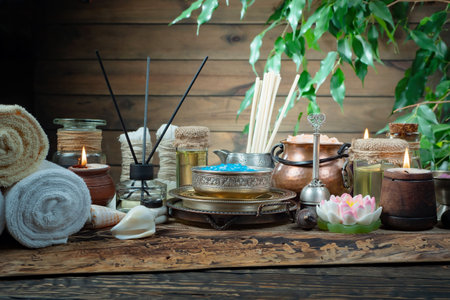Spa still life with candles, herbal tea and towels on wooden backgroundの写真素材