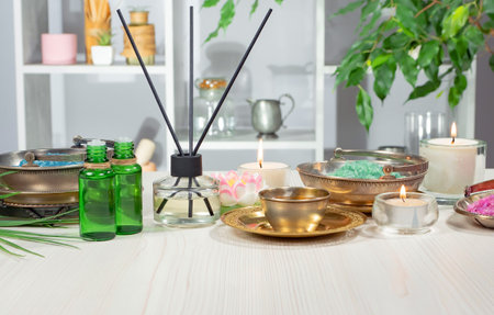 Spa and wellness setting with candles, aroma oils and essential oilsの写真素材