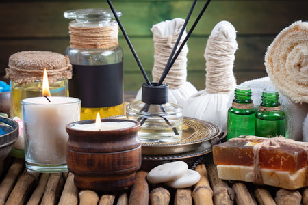 Spa still life with aroma sticks, candles and towels on wooden backgroundの写真素材