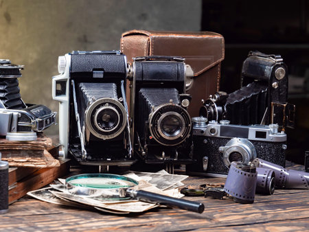 Old cameras on the table in the photo studio, close-up