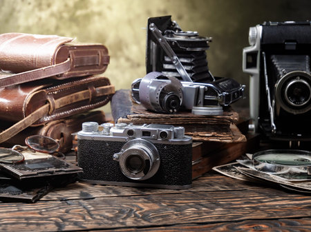 Vintage camera and other old things on a wooden table, still life