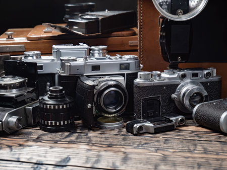Old camera on the wooden table. Vintage camera on the background.