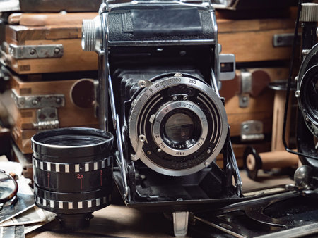 Old camera on the background of old things. Vintage photo camera.