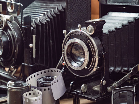 Vintage camera on the background of old pictures. Retro cameraの写真素材