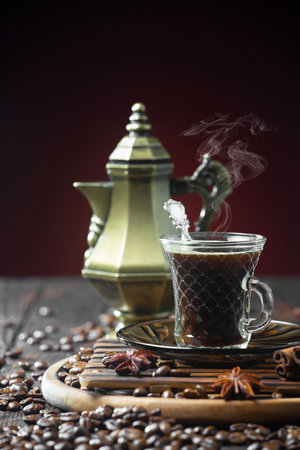 Black coffee in a cup on old wooden table. Selective focusの写真素材