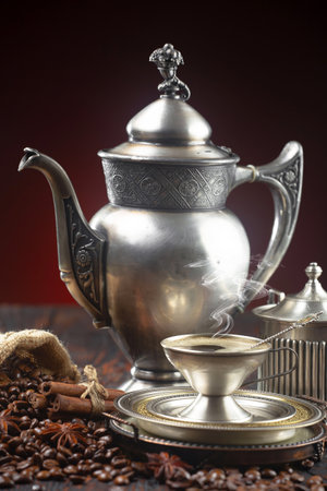 Coffee in a cup and saucer on an old backgroundの写真素材