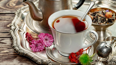 Tea hot drink on old background in composition with accessories on the tableの写真素材