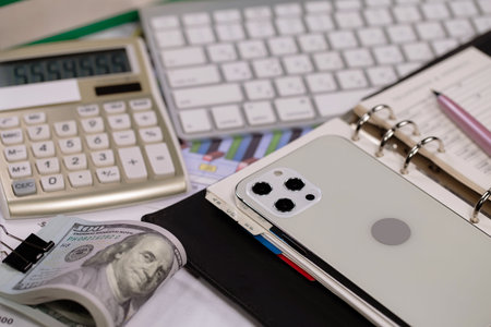 Business Objects in the office on the table: laptop, calculator, pen, moneyの写真素材