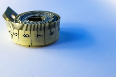 Measuring tape for sewing is on the table. Background for sewing.の写真素材