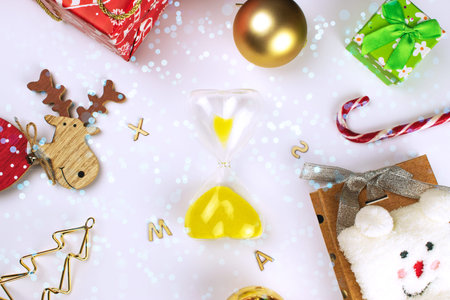 hourglass on the background of Christmas decorations