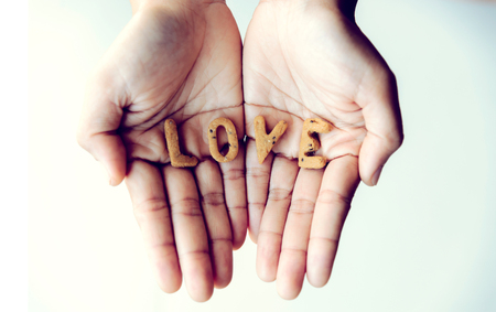 Cookies are letters that are arranged in love. The word love is in the hand. Valentine dayの写真素材