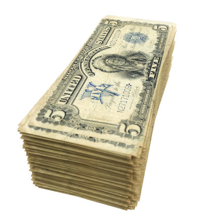 stack of vintage American money isolated on white background