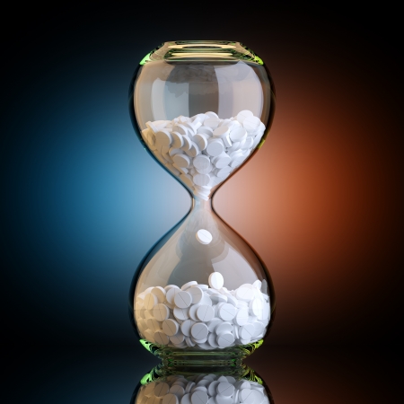 Sand Clock With Pills In Black Studio With Artistic Backlightの写真素材