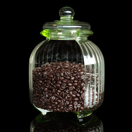 Abstract glass jar with cutting one section and coffee beansの写真素材