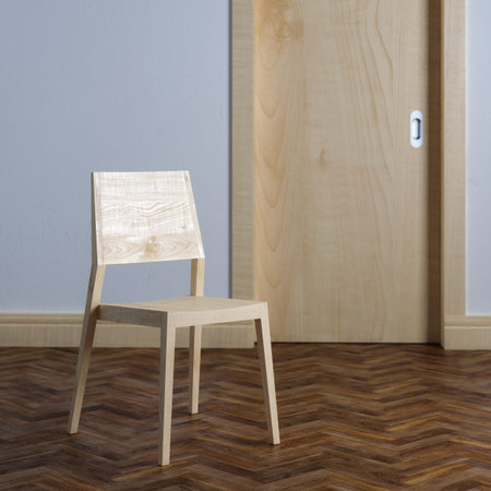 Wooden chair near the door in room interior with parquetの写真素材