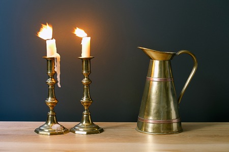 Candelabra With Burning Candles And Antique Jar In Interiorの写真素材