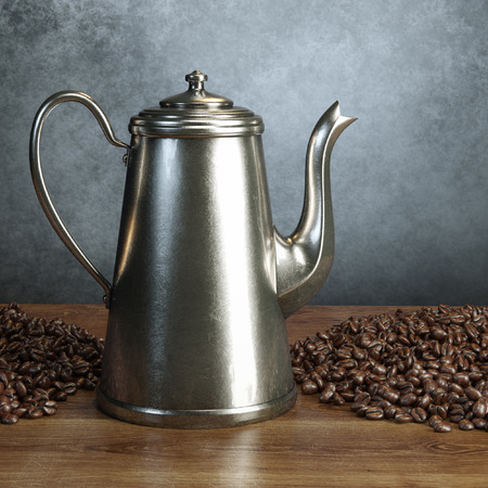 Retro coffee pot with roasted coffee beans on wooden tableの写真素材