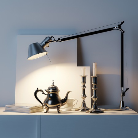 Vintage furniture and empty frame under the light of desk lampの写真素材