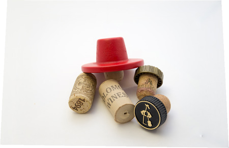five different caps on wine bottles are a small handfulの写真素材