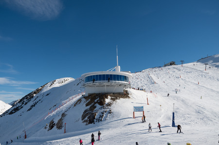 Skiing and snowboarding on the snowy slopes of prepared ski resort in Andorraの写真素材