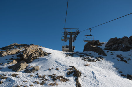 Skiing and snowboarding on the snowy slopes of prepared ski resort in Andorra