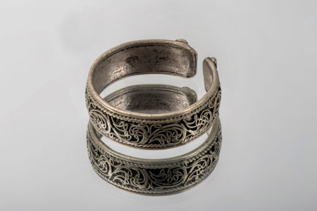 old silver ring on a mirror and is reflected in it