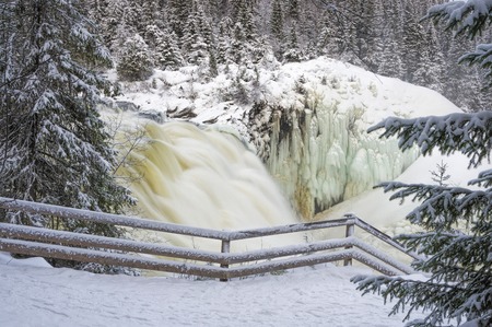 Tannoforsen waterfall in Sweden in winterの写真素材