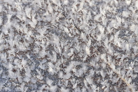 Snowflakes close-up on the table top, background textureの写真素材