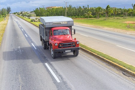 VARADERO, CUBA - JANUARY 05, 2018: Red truck rides on the roadのeditorial素材