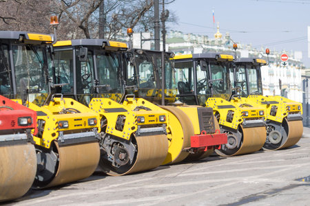 Several rollers for stacking asphalt are next to each other