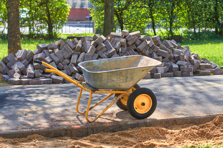 Wheelbarrow for carrying various goods by handの写真素材