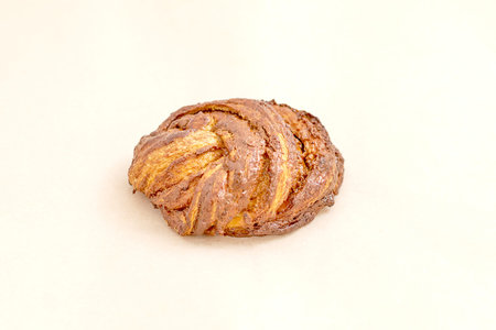 Delicious Golden sweet bun. Fresh pastries, an assortment of bakery and bakery. Closeup on a light...