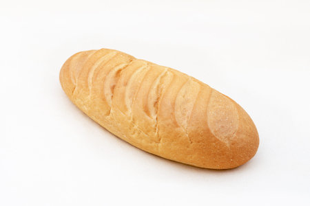 White wheat loaf, assortment of bakery and bakery. Traditional Russian loaf. Close-up on white...